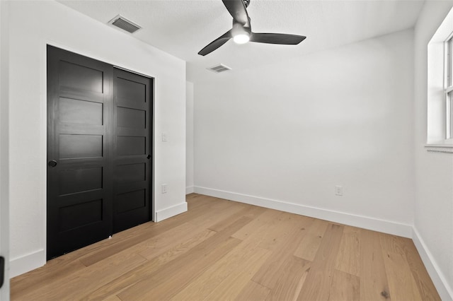 interior space with ceiling fan and light wood-type flooring