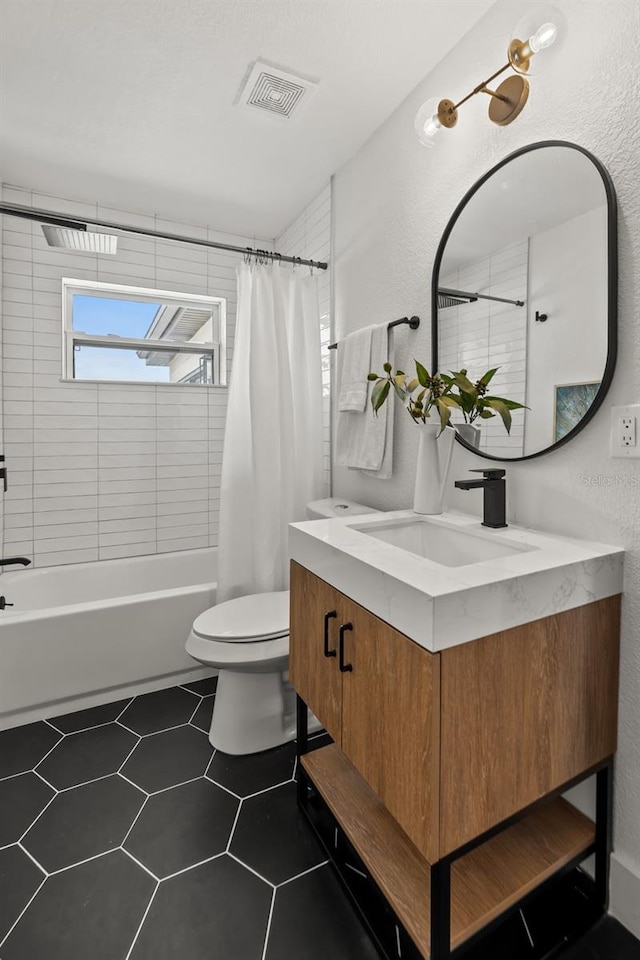 full bathroom with tile patterned flooring, vanity, shower / bath combination with curtain, and toilet