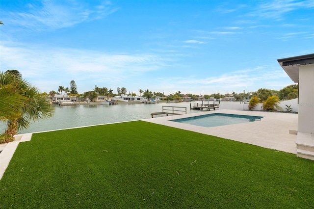 view of pool featuring a lawn, a boat dock, and a water view