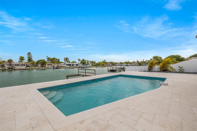 view of pool featuring a patio and a water view