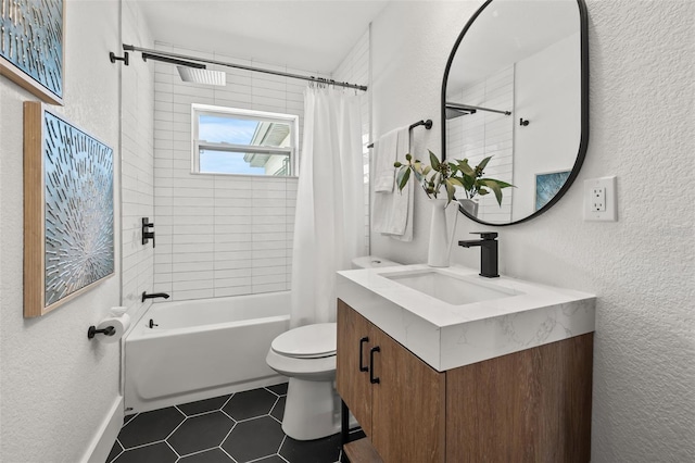 full bathroom featuring vanity, shower / tub combo, tile patterned flooring, and toilet