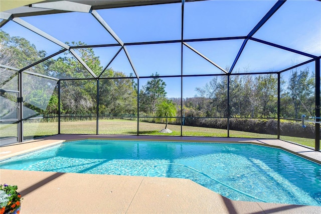 view of swimming pool featuring a yard, a lanai, and a patio area