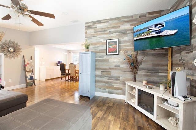 living room with hardwood / wood-style floors and ceiling fan