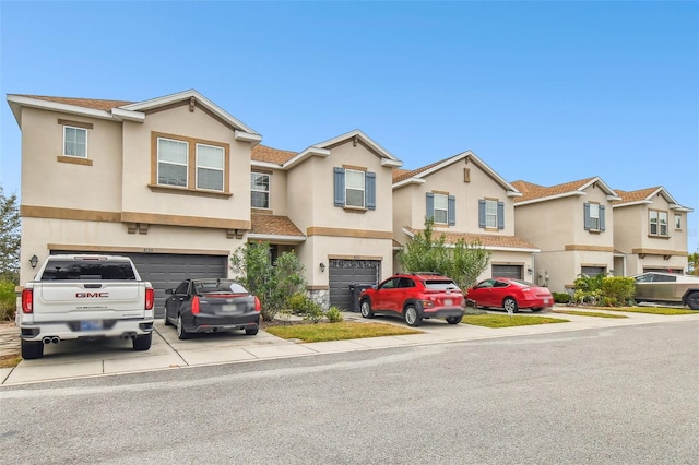 townhome / multi-family property featuring a garage