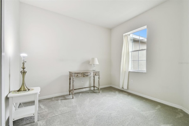 carpeted spare room featuring plenty of natural light