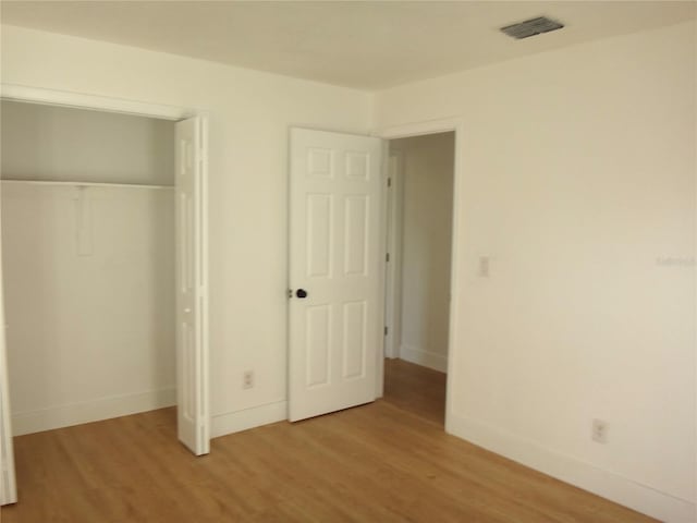 unfurnished bedroom with light hardwood / wood-style floors