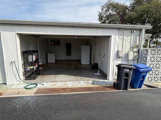 garage with white refrigerator