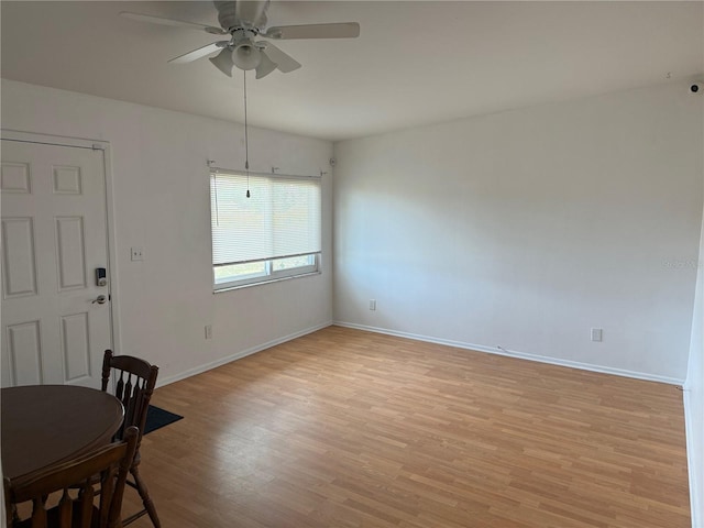 dining area featuring ceiling fan and light wood-type flooring