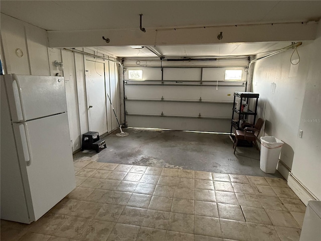 garage featuring white fridge