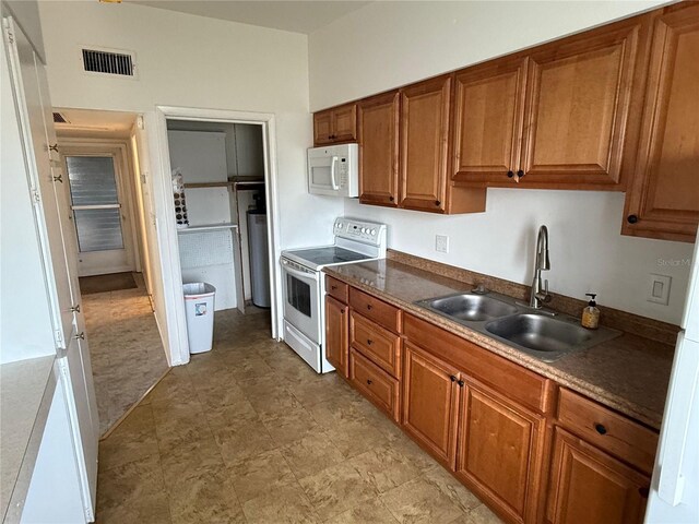 kitchen featuring sink and white appliances