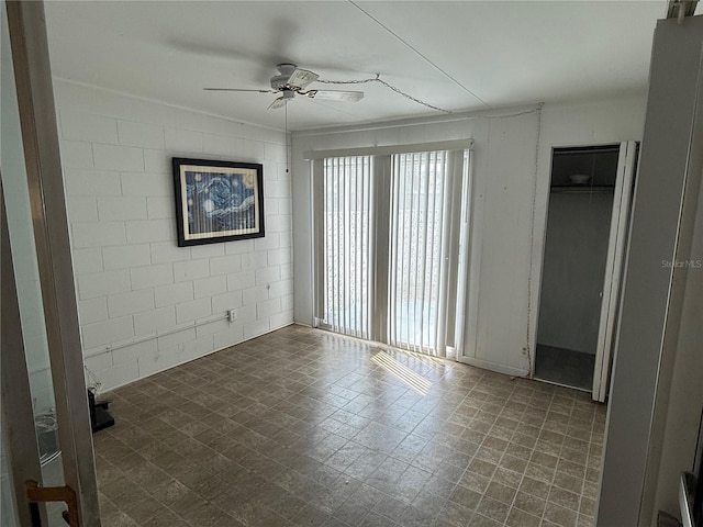 unfurnished room featuring ceiling fan