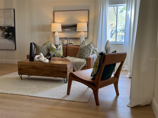 sitting room with light hardwood / wood-style flooring