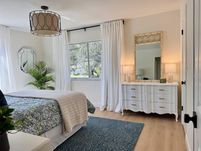 bedroom with light hardwood / wood-style floors