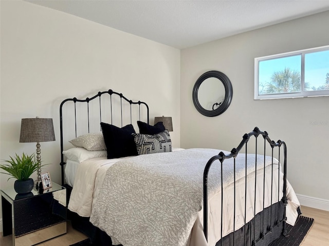 bedroom with light hardwood / wood-style flooring