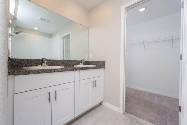 bathroom featuring vanity and tile patterned floors