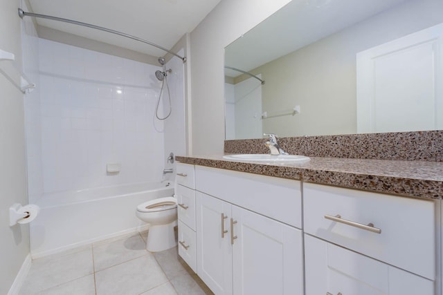 full bathroom with toilet, tiled shower / bath, tile patterned floors, and vanity