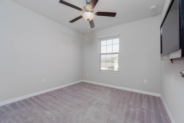 empty room with light carpet and ceiling fan