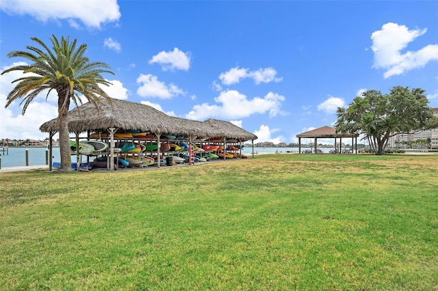 view of yard with a gazebo and a water view