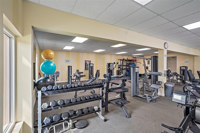 workout area with a paneled ceiling