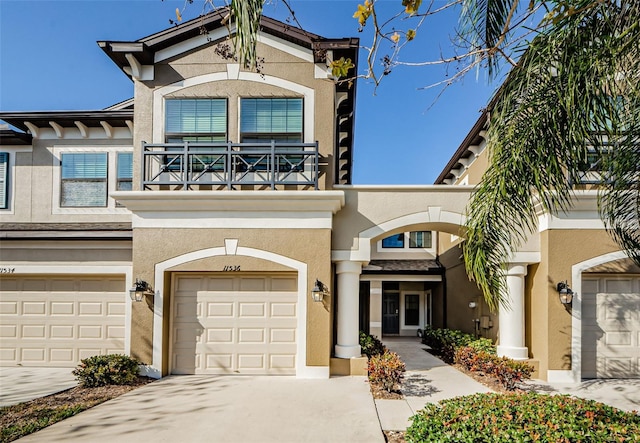 view of front of house featuring a balcony and a garage