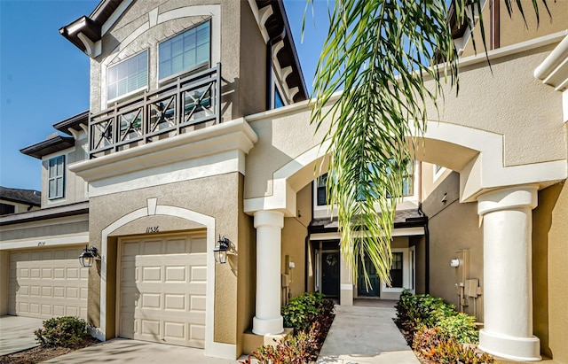 view of front of house with a garage and a balcony