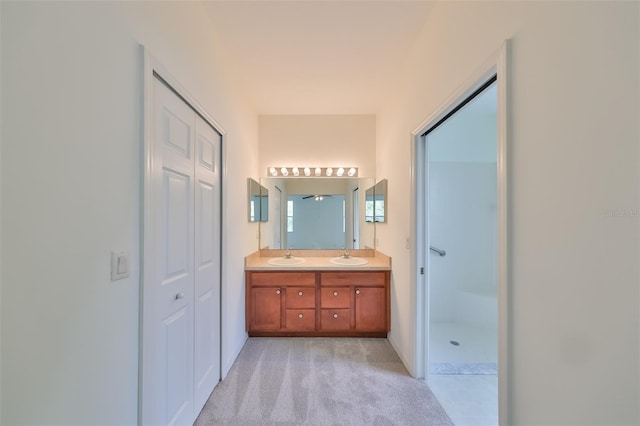 bathroom featuring ceiling fan and vanity