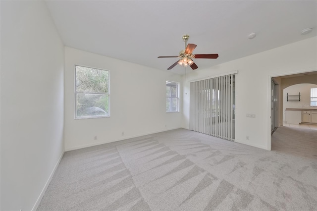 carpeted empty room with ceiling fan