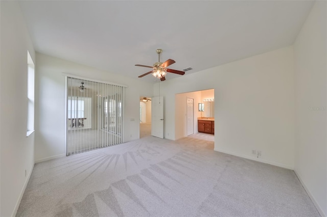 carpeted empty room with ceiling fan