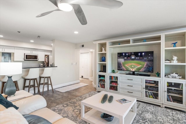 living room with ceiling fan