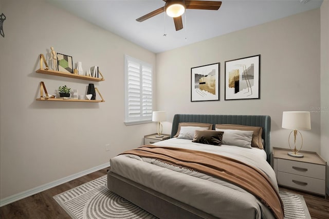 bedroom featuring ceiling fan and dark hardwood / wood-style floors