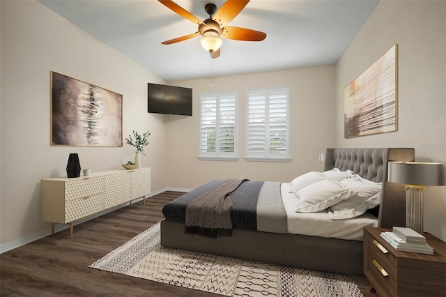 bedroom with ceiling fan and dark hardwood / wood-style floors