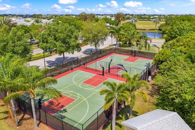 view of basketball court with a water view and tennis court