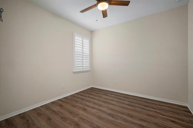 unfurnished room with ceiling fan and dark hardwood / wood-style flooring