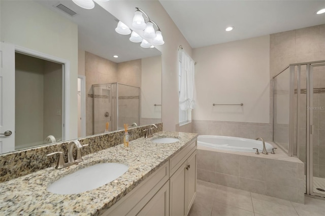 bathroom featuring tile patterned floors, separate shower and tub, and vanity