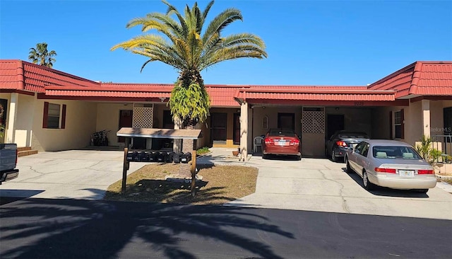 view of front of property with a carport