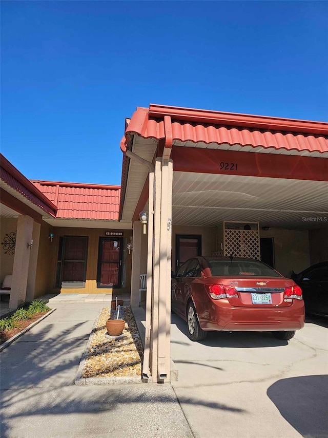 view of front of home with a carport