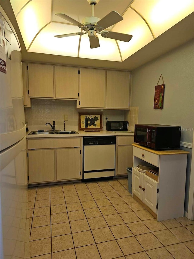 kitchen featuring decorative backsplash, ceiling fan, sink, dishwasher, and light tile patterned flooring