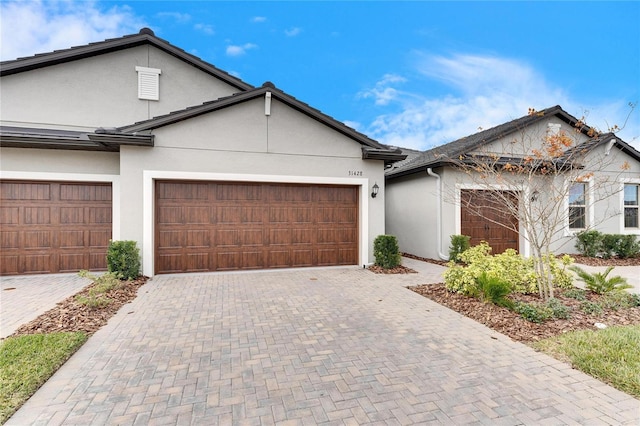 view of front of property with a garage