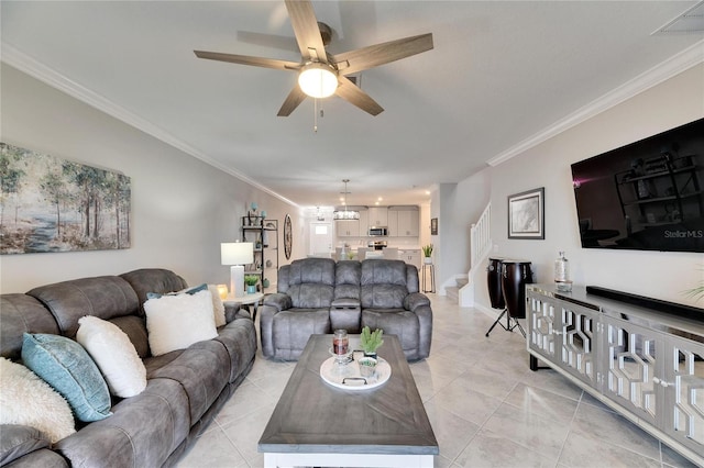 living room with light tile patterned flooring, ceiling fan, and ornamental molding