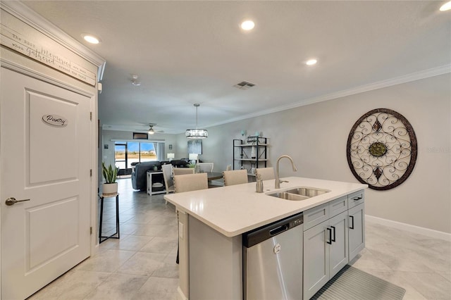 kitchen featuring an island with sink, sink, ceiling fan, stainless steel dishwasher, and crown molding