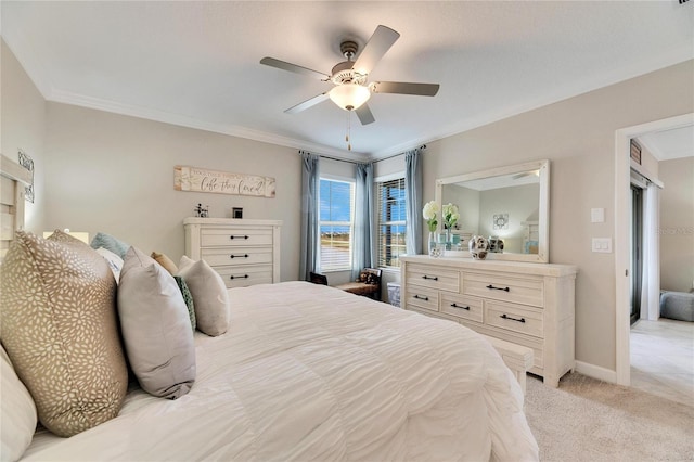 bedroom with ceiling fan, crown molding, and light carpet