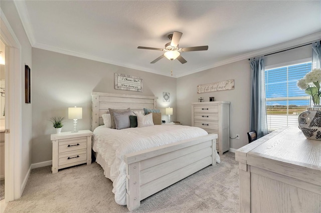 carpeted bedroom featuring ceiling fan and crown molding