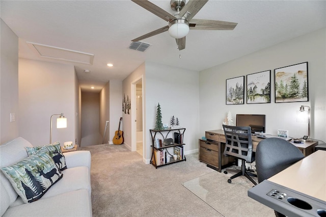 carpeted home office with ceiling fan