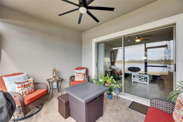 view of patio / terrace featuring ceiling fan and an outdoor living space