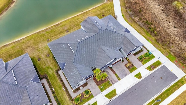 drone / aerial view featuring a water view