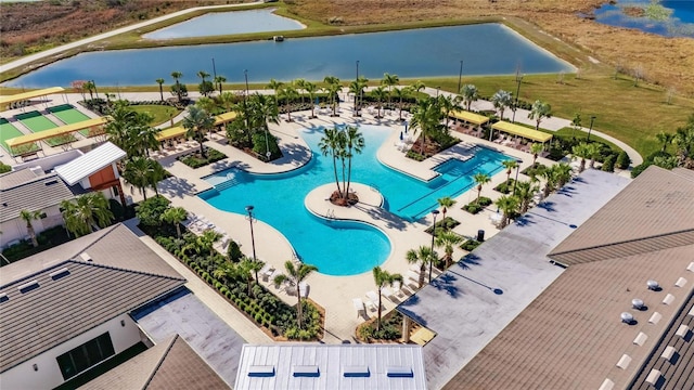 birds eye view of property with a water view