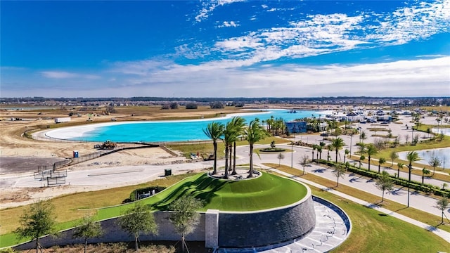 view of swimming pool with a water view