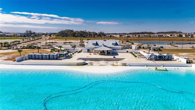 view of swimming pool with a view of the beach