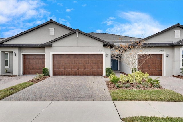 ranch-style house featuring a garage