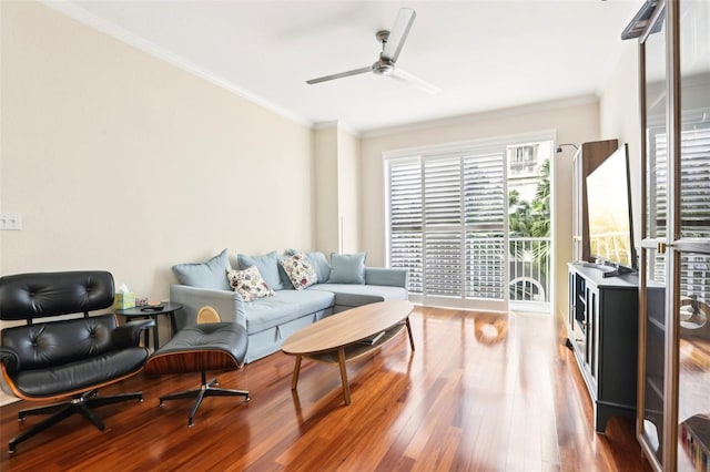 living room featuring hardwood / wood-style flooring, ceiling fan, and ornamental molding